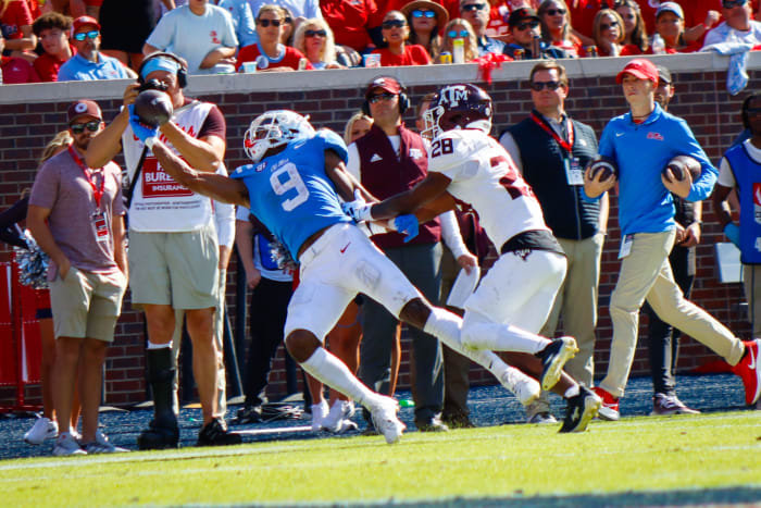 Ole Miss Rebels Tre Harris makes diving grab against Texas A&M defensive back Josh DeBerry at Vaught-Hemingway Stadium in Oxford.